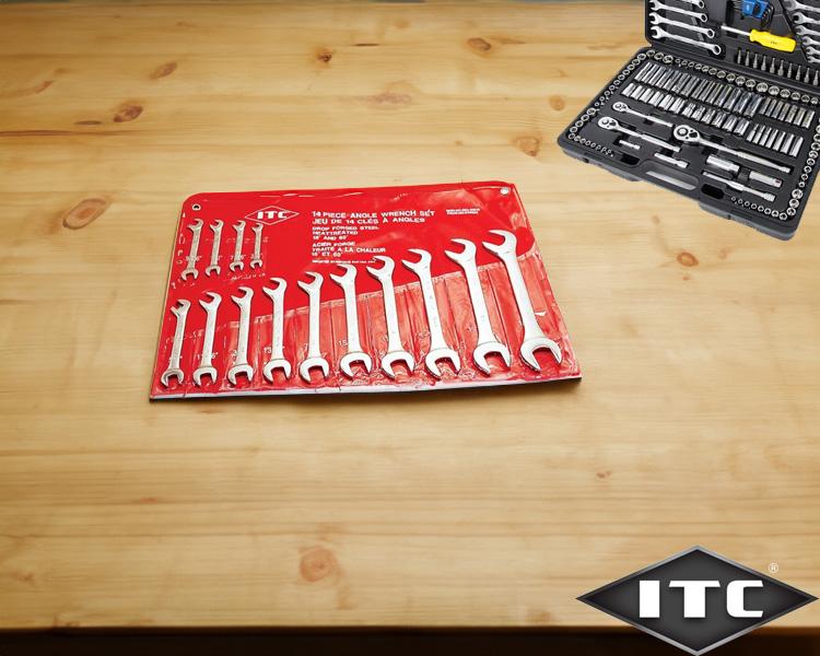 Set of ITC wrenches organized on red holder on wooden table with blurred tool box in background, showcasing high-quality ITC tools